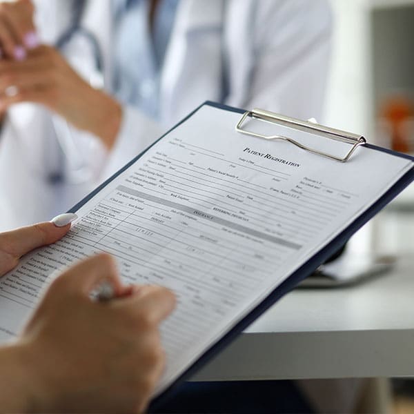 Clinician providing supportive counseling to an adult with schizophrenia
