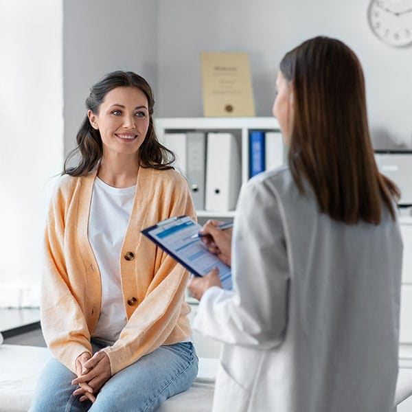 Counselor talking with an adult during an anxiety therapy session