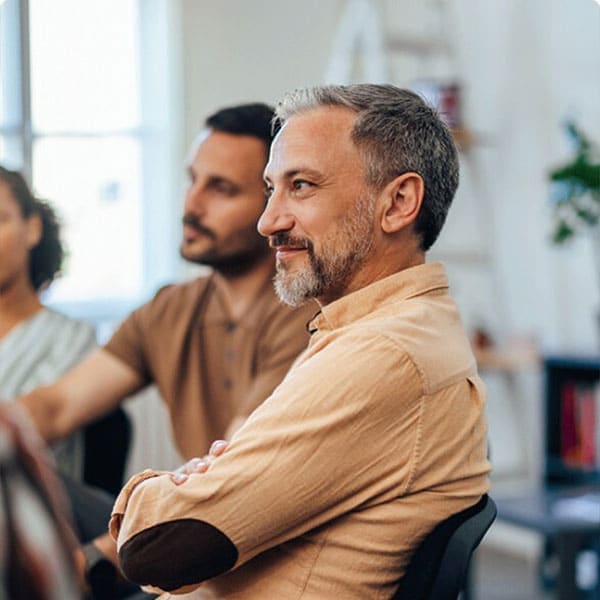 Counselor guiding an adult through OCD exposure and response prevention therapy